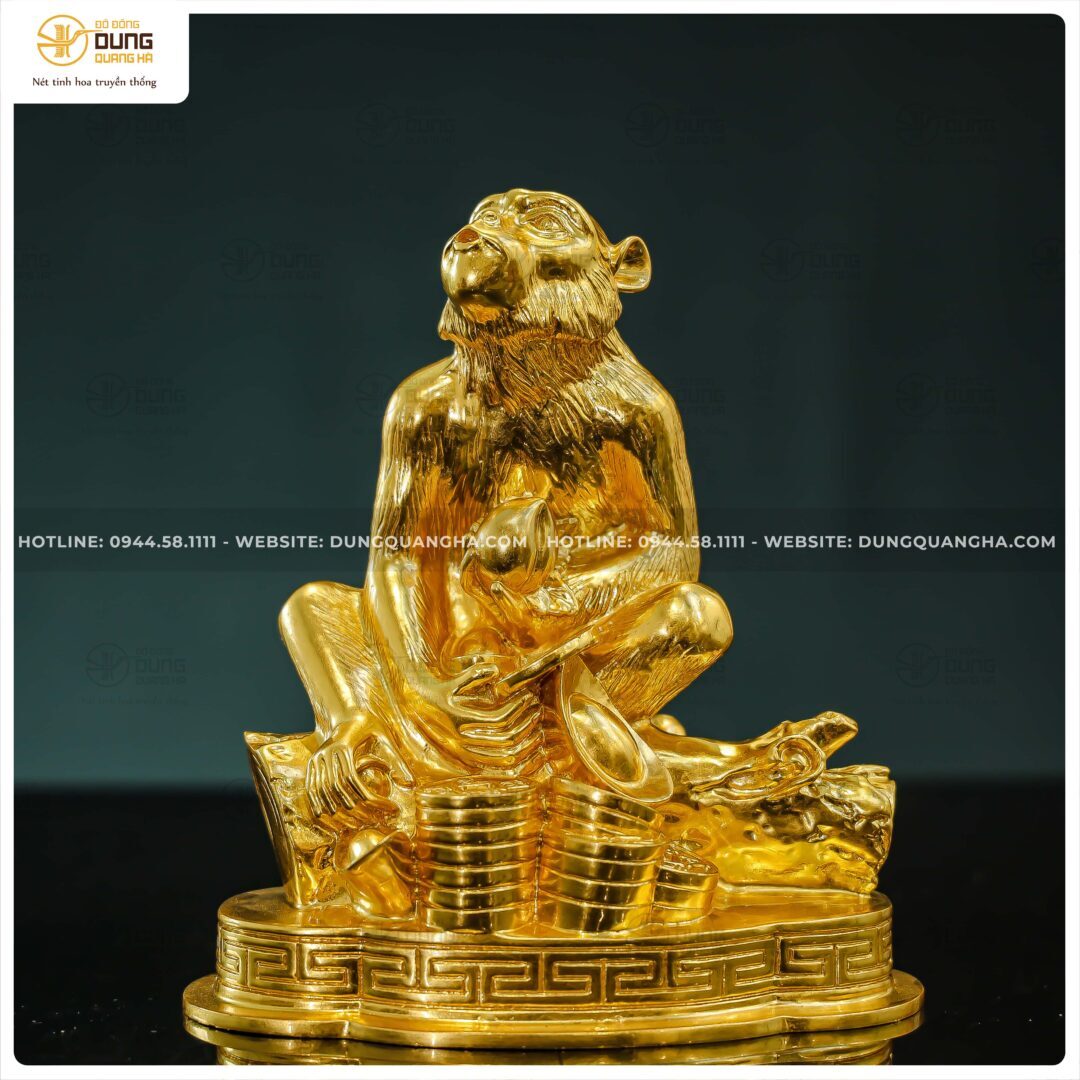 Tượng khỉ ngồi trên tiền vàng bằng đồng catut dát vàng kích thước 20x16x9cm
